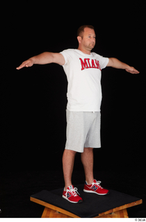 Louis dressed grey shorts red sneakers sports standing t poses…